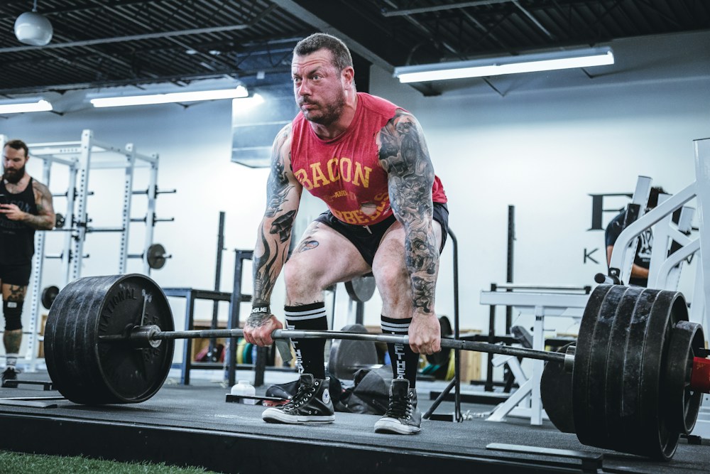 Athlete working with a barbell on the training floor